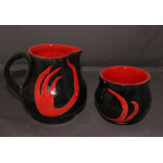Red and black pitcher and cup