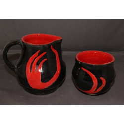 Red and black pitcher and cup