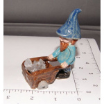Gnome with crystal in wheelbarrow